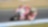 Un pilote sur une moto de course Ducati dans un virage en épingle
