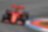 Pilote Ferrari F1 versant de l’huile Shell Helix Ultra dans le moteur d'une voiture
